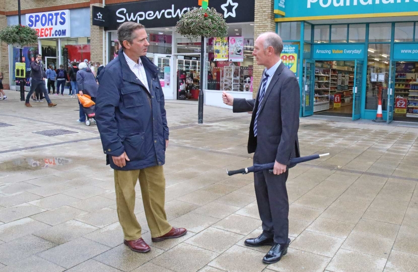 Jonathan Djanogly MP for Huntingdon outside the Chequers Shopping Centre in Huntingdon with Darryl Preston, Conservative candidate in the Cambridgeshire and Peterborough Police and Crime Commissioner election in May 2021.