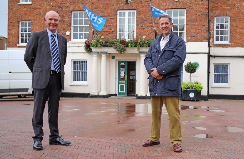 Darryl Preston, Conservative candidate in the Cambridgeshire and Peterborough Police and Crime Commissioner election in May 2021, with Jonathan Djanogly MP for Huntingdon outside NHS Huntingdon.